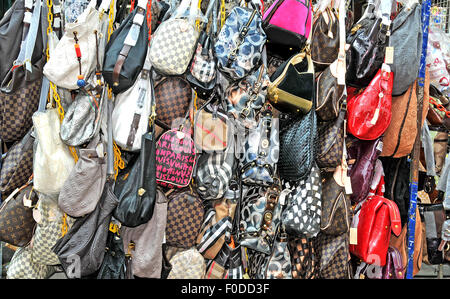 falce Louis Vuitton woman handbags in street Kuala Lumpur Malaysia Stock Photo
