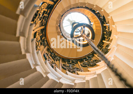 London Southbank Greenwich Maritime Royal Naval College neo classical Chapel spiral helical staircase centre lights chain chains Stock Photo