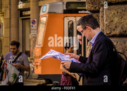 Man reading a map in Milan. Italy. Stock Photo