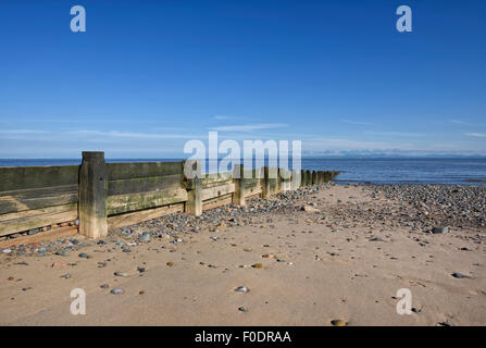 Wooden breakwater on the beach in Fleetwood, Lancashire, UK Stock Photo