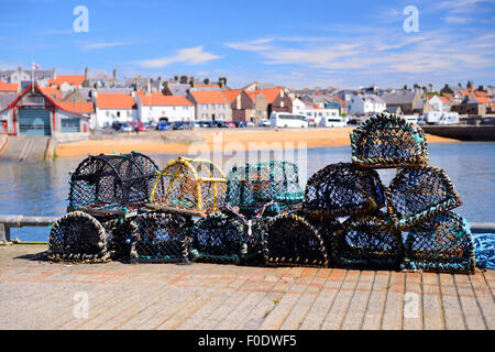 Lobster pots on quayside of picturesque fishing village of Anstruther in East Neuk of Fife, Scotland Stock Photo