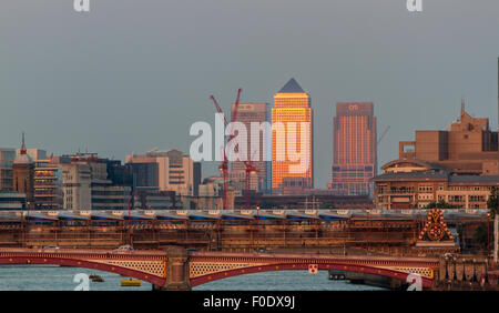 View from Waterloo Bridge looking towards Blackfriars Bridge as the late afternoon sunlight reflects from One Canada Square in Canary Wharf ,London,UK Stock Photo