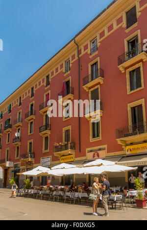 Restaurant situated along the edge of the Grand Canal in the Naviglio area of Milan. Italy. Stock Photo