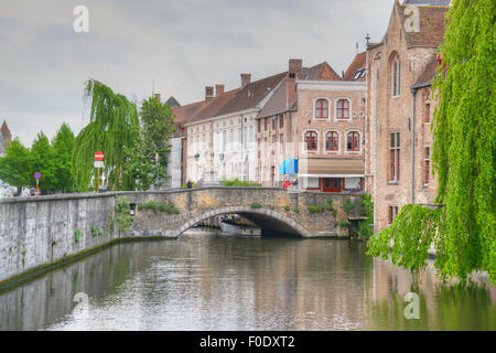 Water canal in Bruges, Belgium showing the bridges to which the city ows its name Stock Photo