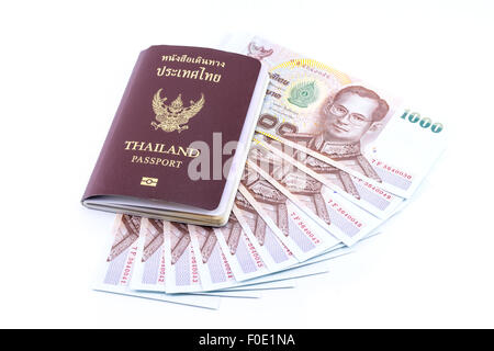 Thai Money 1000 Bath and Thailand passport isolated on white background Stock Photo