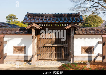 Japan, Kanazawa Castle. Dobei plaster, mud and wood walls with buttresses and shooting holes, called sama, with a small Koraimon style gate. Stock Photo