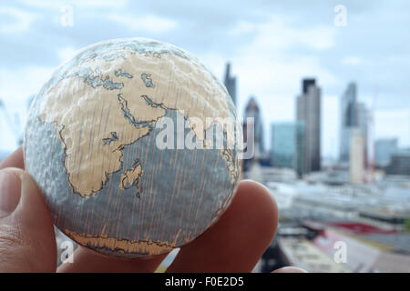 close up of businessman hand showing texture the world concept Elements of this image furnished by NASA london city background Stock Photo