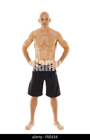 Muay thai or kickbox fighter standing, isolated on white background Stock Photo