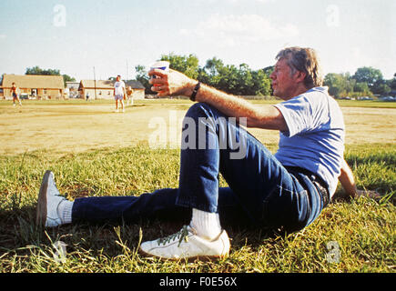 Plains, Georgia, USA. 31st Oct, 1975. Democratic presidential nominee Jimmy Carter relaxes while awaiting his turn at bat at a Secret Service - captained by Jimmy Carter versus The Press - captained by brother Billy Carter softball game. The games were spirited and usually ended in a rout for the Carter/SS team. © Ken Hawkins/ZUMA Wire/Alamy Live News Stock Photo