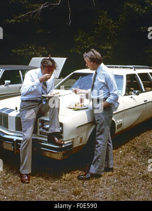 Plains, Georgia, USA. 2nd Jan, 1977. Jimmy Carter and Walter Mondale get away from the crowd for a private talk while attending a church picnic at the Plains Baptist Church. © Ken Hawkins/ZUMA Wire/Alamy Live News Stock Photo