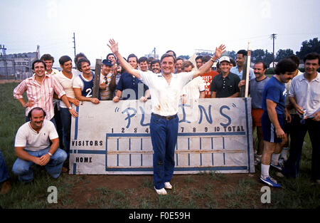 Jan. 1, 2015 - Plains, Georgia, USA - A post softball game photo of a team of off duty US Secret Service agents is upstaged by a red clay stained Vice President Walter Mondale as he jumped into the middle of the team photo at the Plains, Georgia High School baseball field in 1977. The Secret Service agents played on President Jimmy Carter's team that played against a team made up by members of the White House traveling press. (Credit Image: © Ken Hawkins via ZUMA Wire) Stock Photo