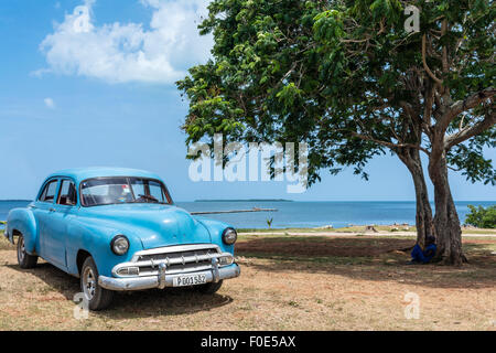 Classic car and sea in Cuba Stock Photo