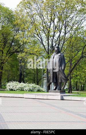 Sculpture of Latvian writer and literary critic Andrejs Upīts next to Riga Congress Hall in Riga, Latvia Stock Photo