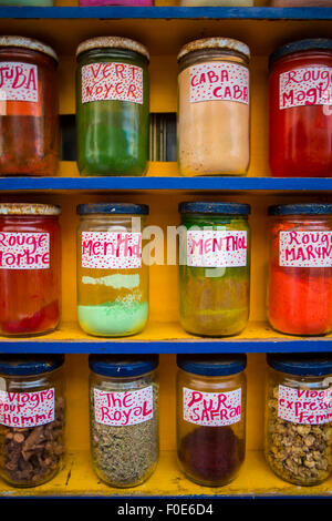 Jars of herbs and powders in a Moroccan spice shop in Essaouira, Morocco Stock Photo