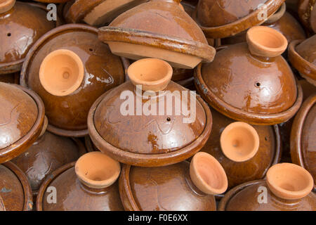 Selection of brown Moroccan tajines (traditional casserole dishes) found at the market Stock Photo