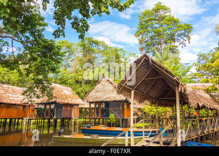 Jungle shacks on stilts in the Amazon rain forest near Iquitos, Peru Stock Photo