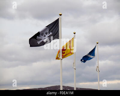 Lion Rampant saltire and skull and crossbones flags Stock Photo