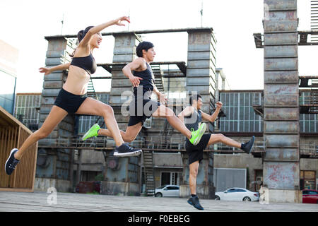 Young joggers running outdoors Stock Photo