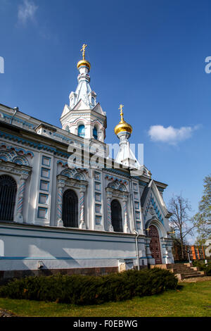 Side view of Orthodox Ss Boris and Gleb Cathedral in Dougavpils, Latvia, on blue Cloudy sky background. Stock Photo