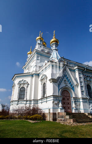 Side view of Orthodox Ss Boris and Gleb Cathedral in Dougavpils, Latvia, on blue cloudy sky background. Stock Photo