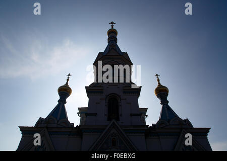Bottom front silhouette view of Orthodox Ss Boris and Gleb Cathedral in Dougavpils, Latvia, on blue sky background. Stock Photo