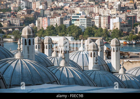 View across the domes of the shopping arcade from the Suleymaniye Mosque towards the city of Istanbul Stock Photo
