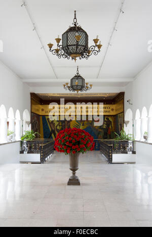 Huge bunch of red roses in stone vase in Quito. Ecuador. Stock Photo