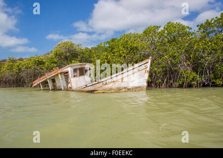 Small fishing boat moored in Punta Gallinas with blue sky in the background, La Guajira, Colombia 2014. Stock Photo
