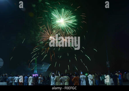 Lahore, Pakistan. 13th Aug, 2015. A splendid view of the fire works by the Pakistan Horticulture Authority (PHA) on the eve of Independence Day in Lahore. The annual celebration is every 14th day of August, since the country gained its independence from the British rule on August 14, 1947. The celebration consist of fire works and people parade dress-up in green and white, which represents Pakistans' official flag colors. Credit:  Rana Sajid Hussain/Pacific Press/Alamy Live News Stock Photo