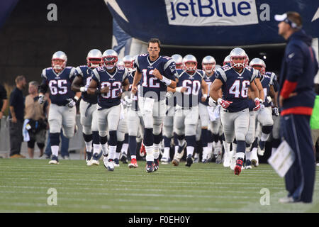 Foxborough, Massachusetts, USA. 13th August, 2015. New England Patriots quarterback Tom Brady (12) leads the Patriots onto the field at an NFL pre-season game between the Green Bay Packers and the New England Patriots held at Gillette Stadium in Foxborough Massachusetts. The Packers defeated the Patriots 22-11 in regulation time. Eric Canha/CSM/Alamy Live News Stock Photo