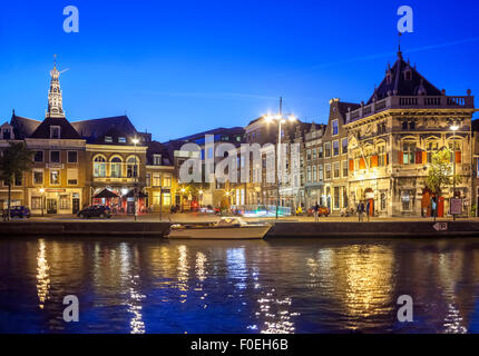 Haarlem view of the Spaarne River w 16C historic building De Waag, Weigh House, now a pub; St Bavo Church in the background. Stock Photo