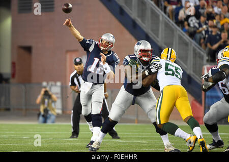Foxborough, Massachusetts, USA. 13th August, 2015. New England Patriots quarterback Tom Brady (12) throws a pass during an NFL pre-season game between the Green Bay Packers and the New England Patriots held at Gillette Stadium in Foxborough Massachusetts. The Packers defeated the Patriots 22-11 in regulation time. Eric Canha/CSM/Alamy Live News Stock Photo