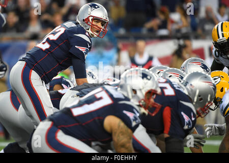 Foxborough, Massachusetts, USA. 13th August, 2015. New England Patriots quarterback Tom Brady (12) gets ready to take a snap during an NFL pre-season game between the Green Bay Packers and the New England Patriots held at Gillette Stadium in Foxborough Massachusetts. The Packers defeated the Patriots 22-11 in regulation time. Eric Canha/CSM/Alamy Live News Stock Photo