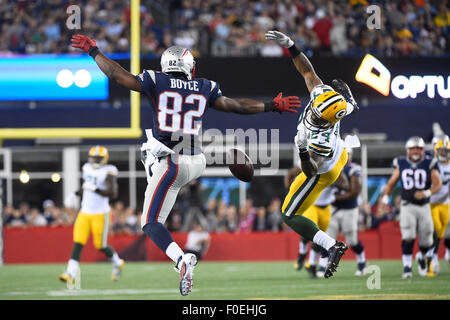 Foxborough, Massachusetts, USA. 13th August, 2015. Green Bay Packers cornerback Quinten Rollins (24) disrupts a pass to New England Patriots wide receiver Josh Boyce (82) during an NFL pre-season game between the Green Bay Packers and the New England Patriots held at Gillette Stadium in Foxborough Massachusetts. The Packers defeated the Patriots 22-11 in regulation time. Eric Canha/CSM/Alamy Live News Stock Photo