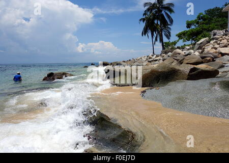 Man standing in water at secluded beach near Puerto Vallarta, Mexico. Stock Photo