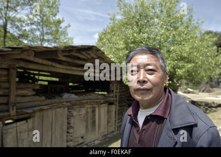 Chongqing, Chongqing, CHN. 7th May, 2015. Chongqing, CHINA - May 6 2015: (EDITORIAL USE ONLY. CHINA OUTï¼‰The village chief. Grassy paths, farmland surrounded by hedge, Smoke and green forests''¦''¦Villagers live a happy life in wooden houses of Fangdouping Village Gaonan Town. © SIPA Asia/ZUMA Wire/Alamy Live News Stock Photo