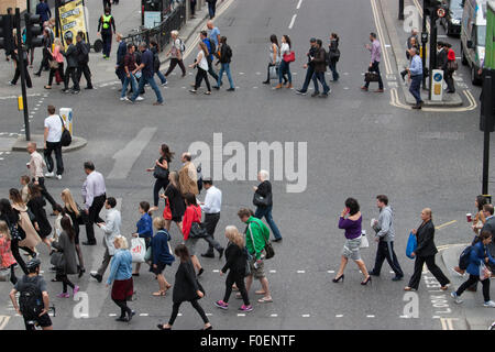 London commuters crossing road during morning rush hour Wormwood street and London Wall Stock Photo