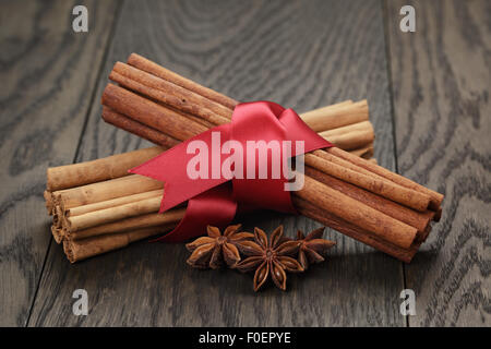 cinnamon sticks and anise tied with ribbon Stock Photo