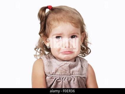 Portrait of sad crying baby girl on white Stock Photo