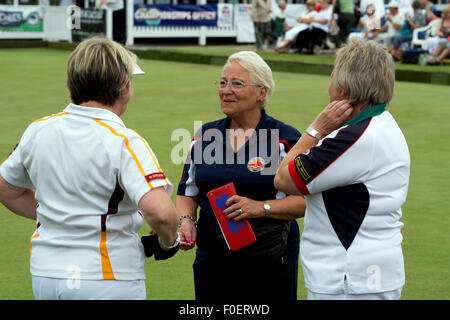 Women lawn bowls players talking to the umpire Stock Photo