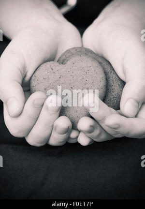Close up of girl holding ginger bread cookies in her hands. Stock Photo