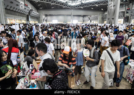 Tokyo, Japan. 14th August, 2015. Visitors gather at the ''Comic Market 88 Summer 2015'' exhibition at Tokyo Big Sight on August 14, 2015, Tokyo, Japan. Thousands of manga and anime fans attended the first day of the Comic Market 88 (Comiket) at Tokyo Big Sight. The Comic Market was established in 1975 to allow fans and artists to interact and focuses on manga, anime, gaming and cosplay. The exhibition is held from August 14th to 16th and Comiket organisers expect more than 500,000 visitors to attend. Credit:  Rodrigo Reyes Marin/AFLO/Alamy Live News Stock Photo