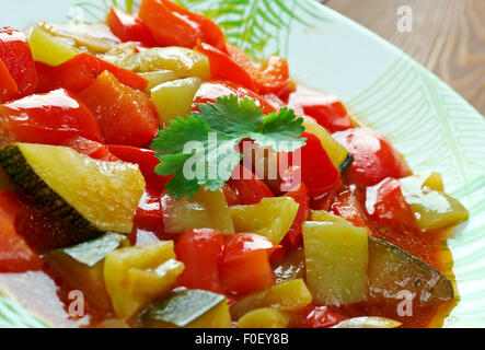 Pisto -  Spanish dish . made of tomatoes, onions, eggplant or courgettes, green and red peppers and olive oil Stock Photo