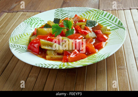 Pisto -  Spanish dish . made of tomatoes, onions, eggplant or courgettes, green and red peppers and olive oil Stock Photo