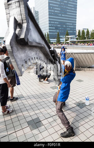 Tokyo, Japan. 14th August, 2015. A cosplayer poses for a picture during the ''Comic Market 88 Summer 2015'' exhibition at Tokyo Big Sight on August 14, 2015, Tokyo, Japan. Thousands of manga and anime fans attended the first day of the Comic Market 88 (Comiket) at Tokyo Big Sight. The Comic Market was established in 1975 to allow fans and artists to interact and focuses on manga, anime, gaming and cosplay. The exhibition is held from August 14th to 16th and Comiket organisers expect more than 500,000 visitors to attend. Credit:  Rodrigo Reyes Marin/AFLO/Alamy Live News Stock Photo