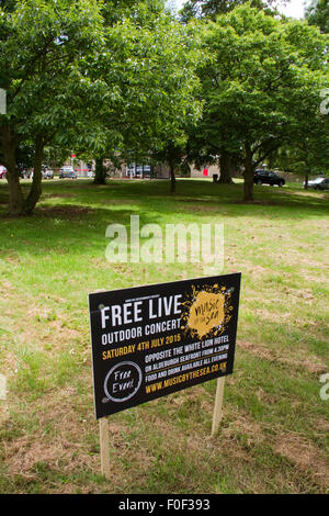 On an Aldeburgh green a board advertising a free concert Stock Photo