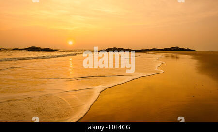 Sunset at Chera Rock, a stretch of deserted sandy beach along the Malabar Coast. Stock Photo