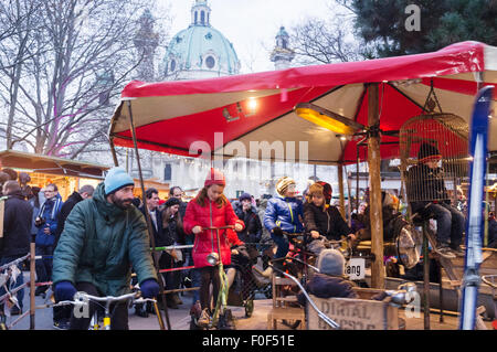 Eco-friendly recycled merry-go-round at the Christmas market in Karlplatz, Vienna, Austria Stock Photo