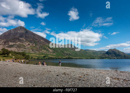 Families enjoying a beautiful British summer's day on the northern shores of Crummock Water in the English Lake District