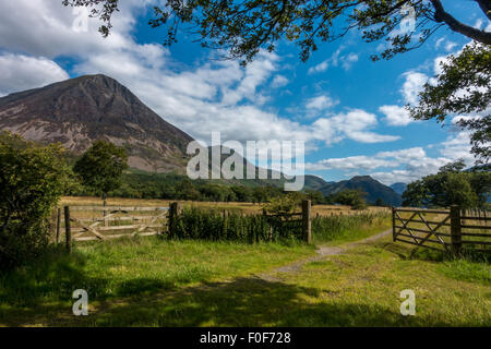 Beautiful Lakeland view - An open gate heading towards the northern side of Crummock Water with Grassmoor on the left hand side. Stock Photo
